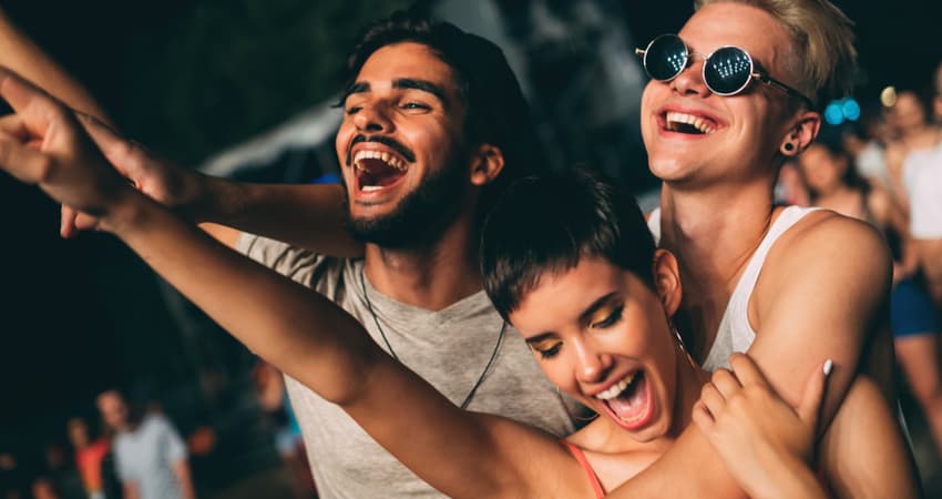 a group of friends hugging and smiling